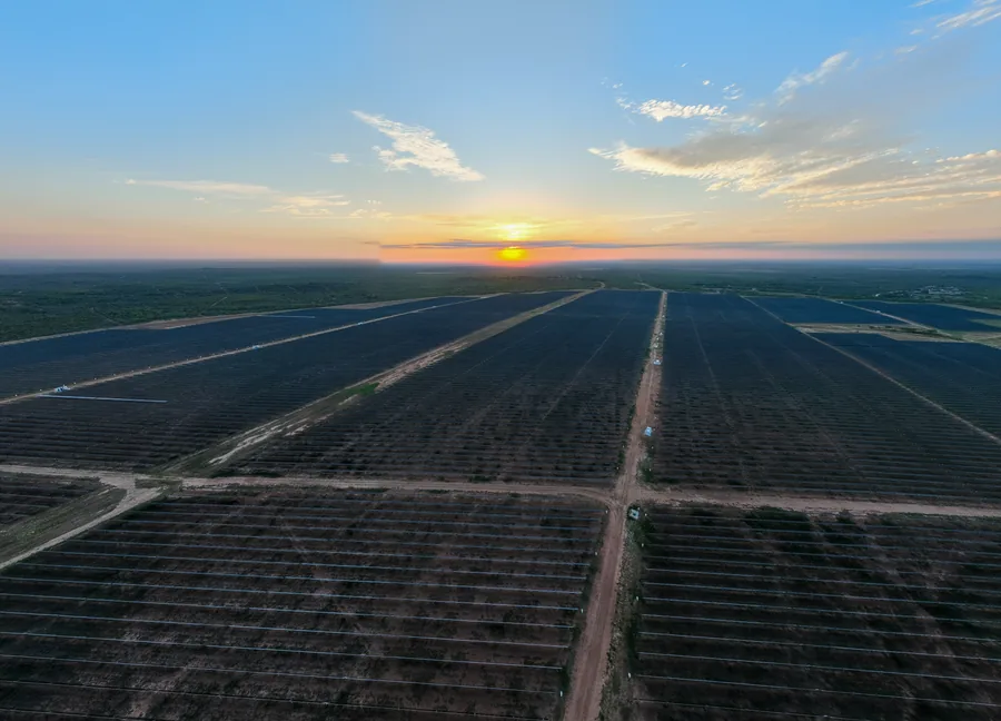 Solar farm aerial drone shot at sunset — FAA certified drone photography Texas