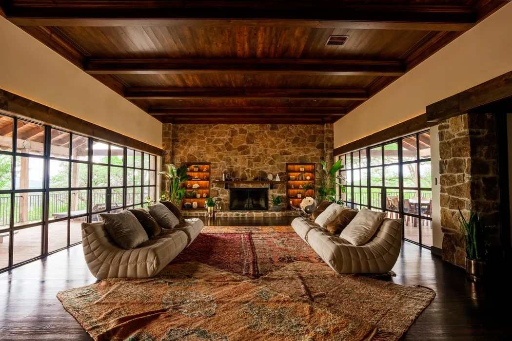 Luxury retreat interior with stone fireplace — commercial photography Austin TX