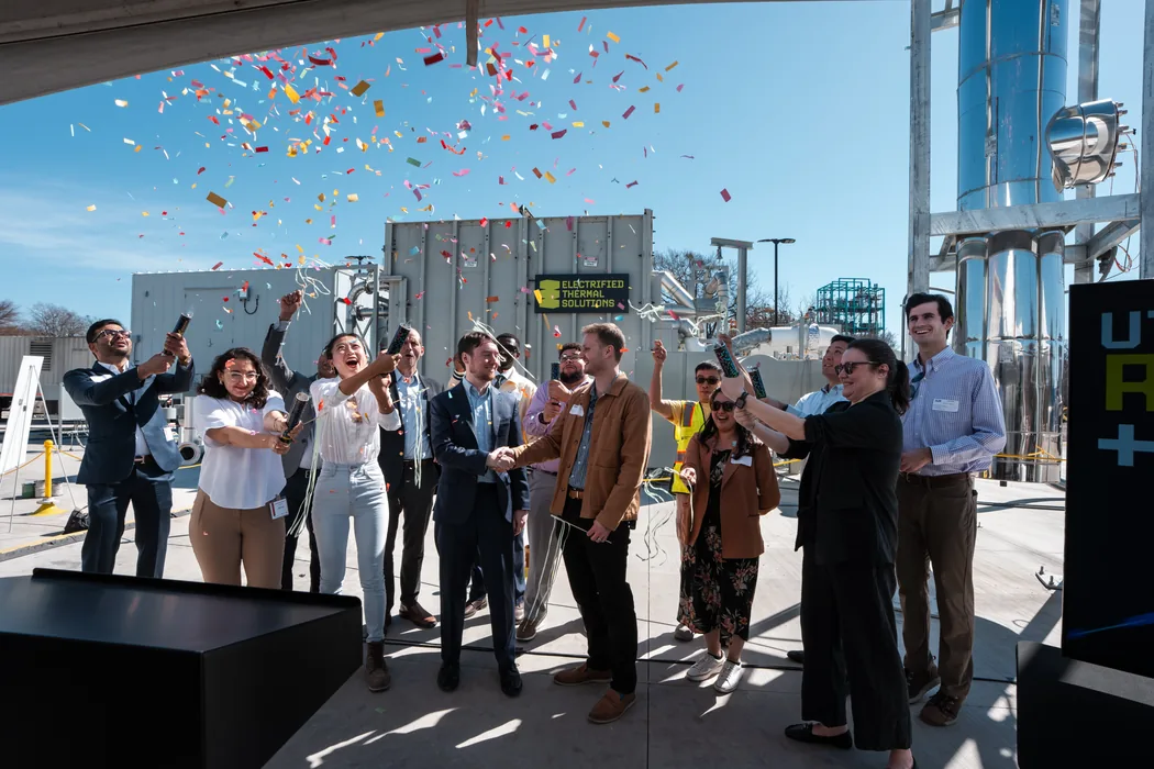 Ribbon cutting celebration with confetti — corporate event photography Austin TX